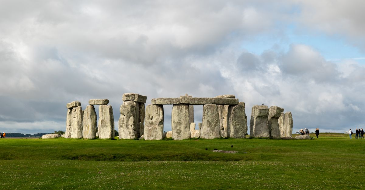 A stunning view of Stonehenge against a backdrop of dramatic clouds.